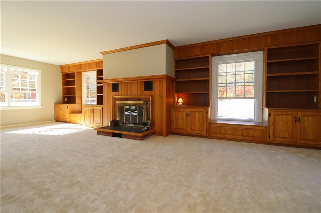 236 Smith Road Franklin, PA 16323 - Photo 9 of 22 an empty room with furniture and a fireplace