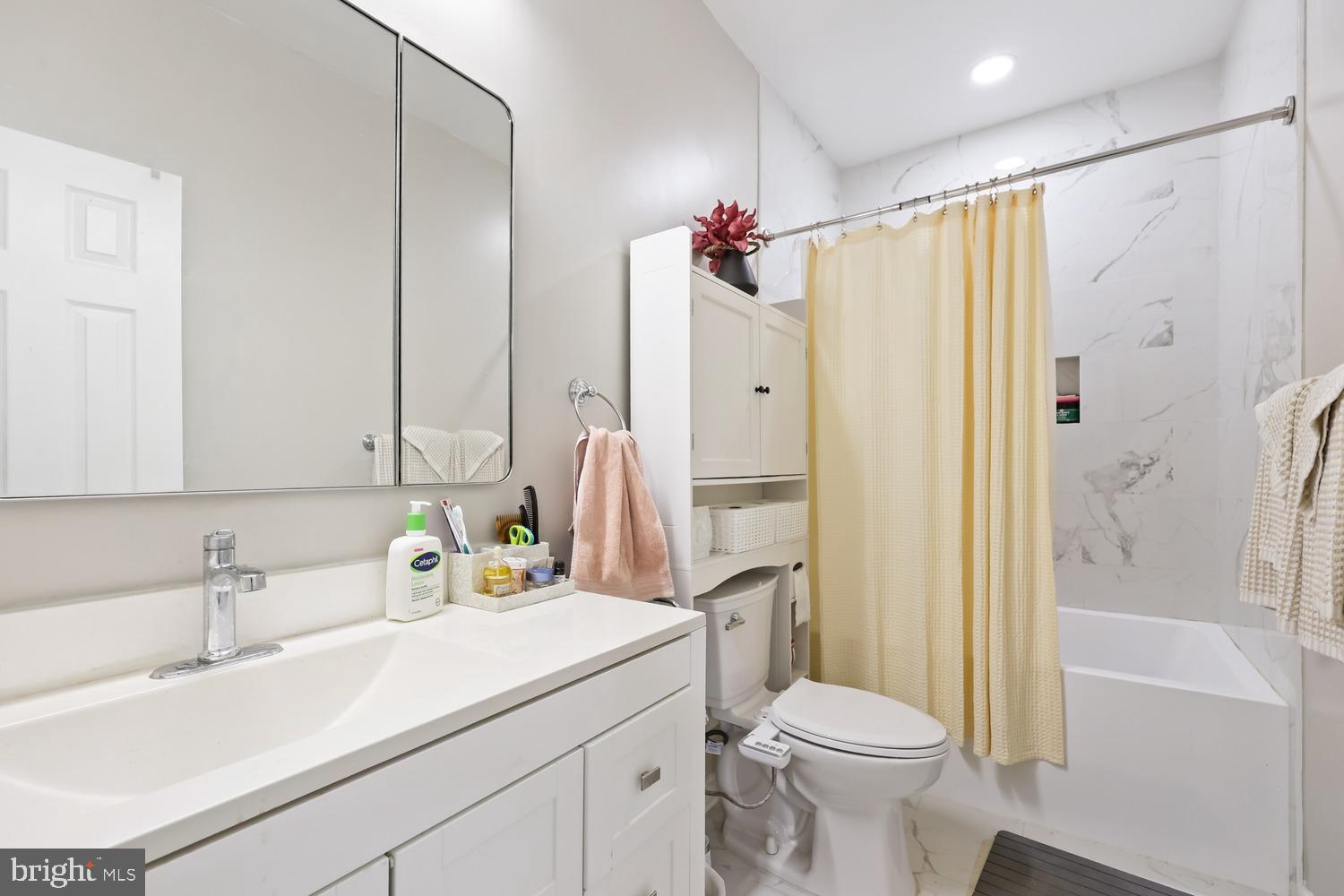 9463 Rogues Road Midland, VA 22728 - Photo 19 of 35 a bathroom with a sink toilet and shower