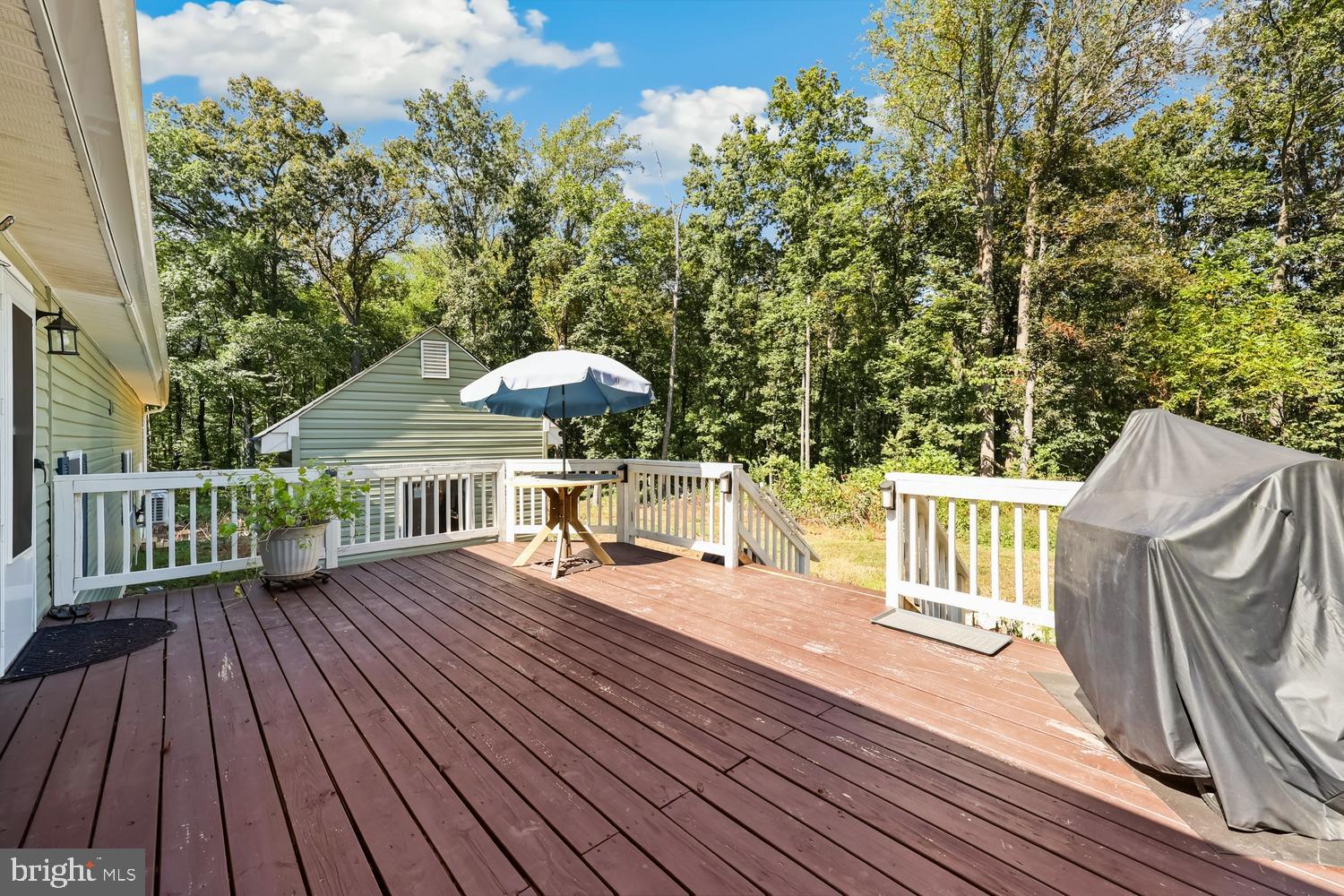 9463 Rogues Road Midland, VA 22728 - Photo 25 of 35 a view of balcony with wooden floor and outdoor seating