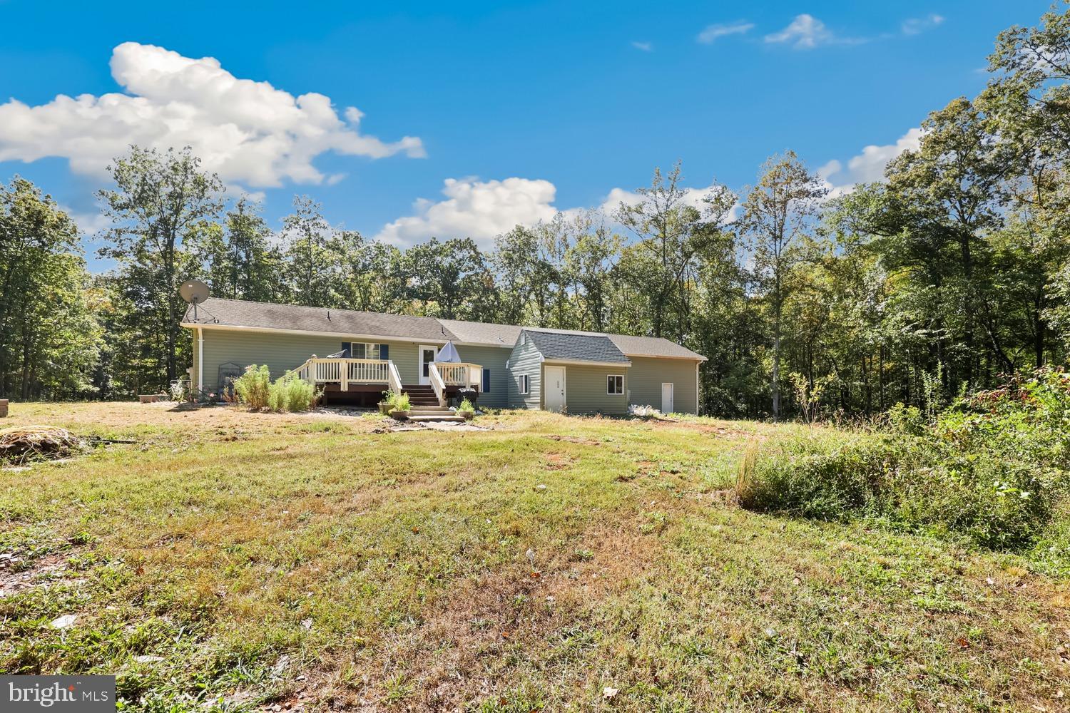 9463 Rogues Road Midland, VA 22728 - Photo 28 of 35 a front view of a house with a yard and trees