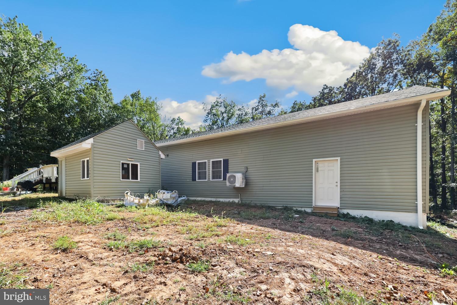 9463 Rogues Road Midland, VA 22728 - Photo 29 of 35 a house with trees in the background