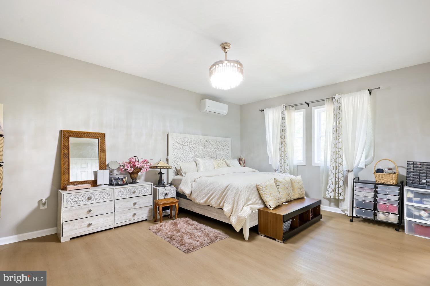 9463 Rogues Road Midland, VA 22728 - Photo 3 of 35 a spacious bedroom with a bed and a window