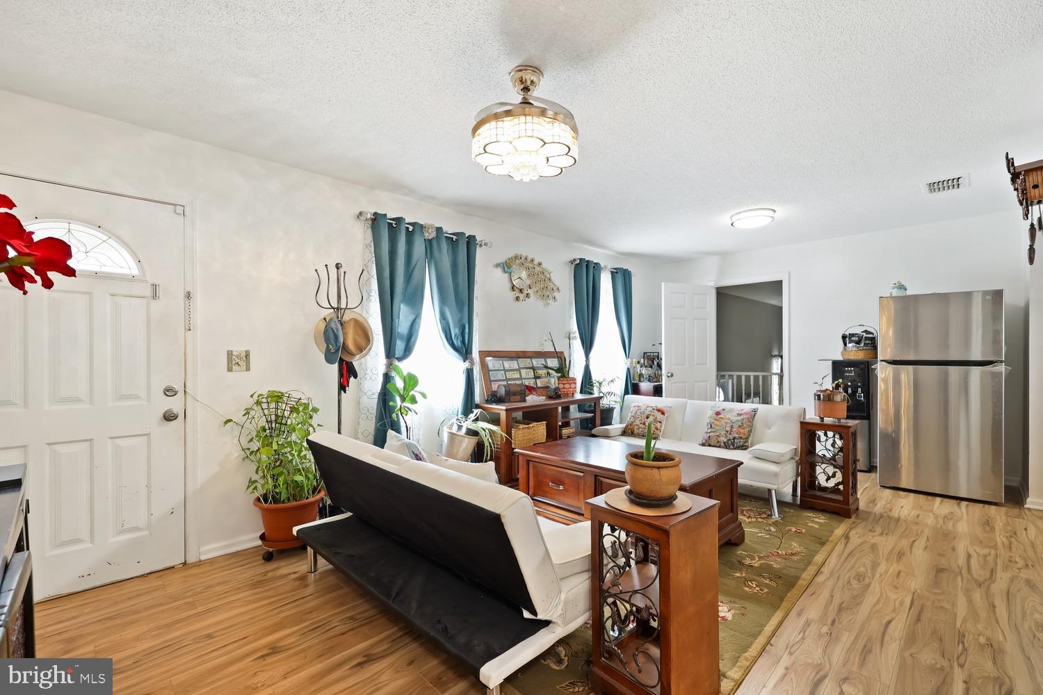 9463 Rogues Road Midland, VA 22728 - Photo 4 of 35 a living room with furniture and a wooden floor