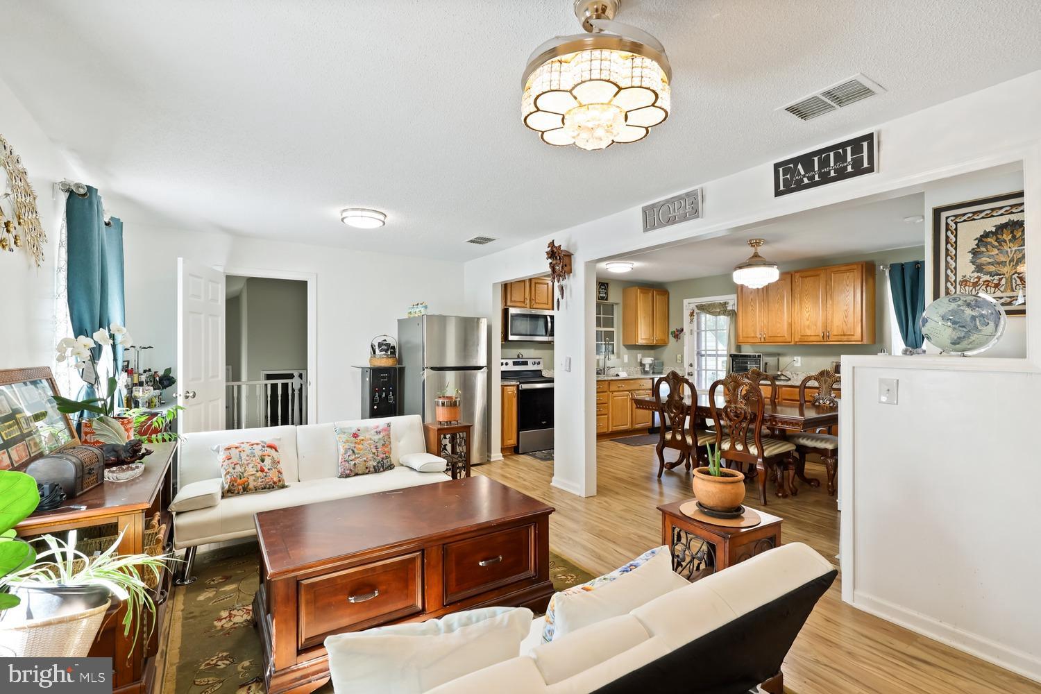 9463 Rogues Road Midland, VA 22728 - Photo 5 of 35 a living room with dining table and chairs