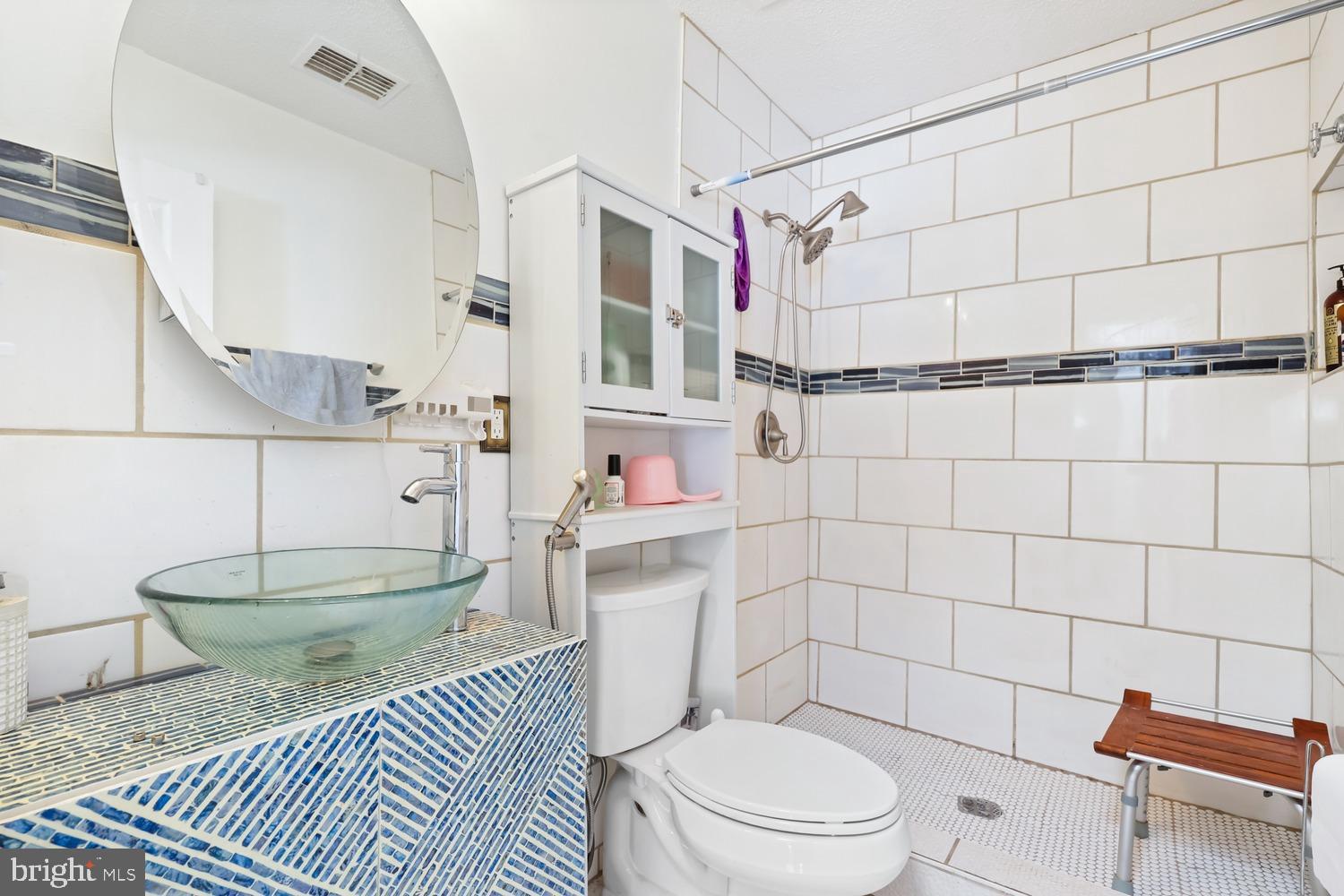 9463 Rogues Road Midland, VA 22728 - Photo 8 of 35 a bathroom with a sink toilet and shower