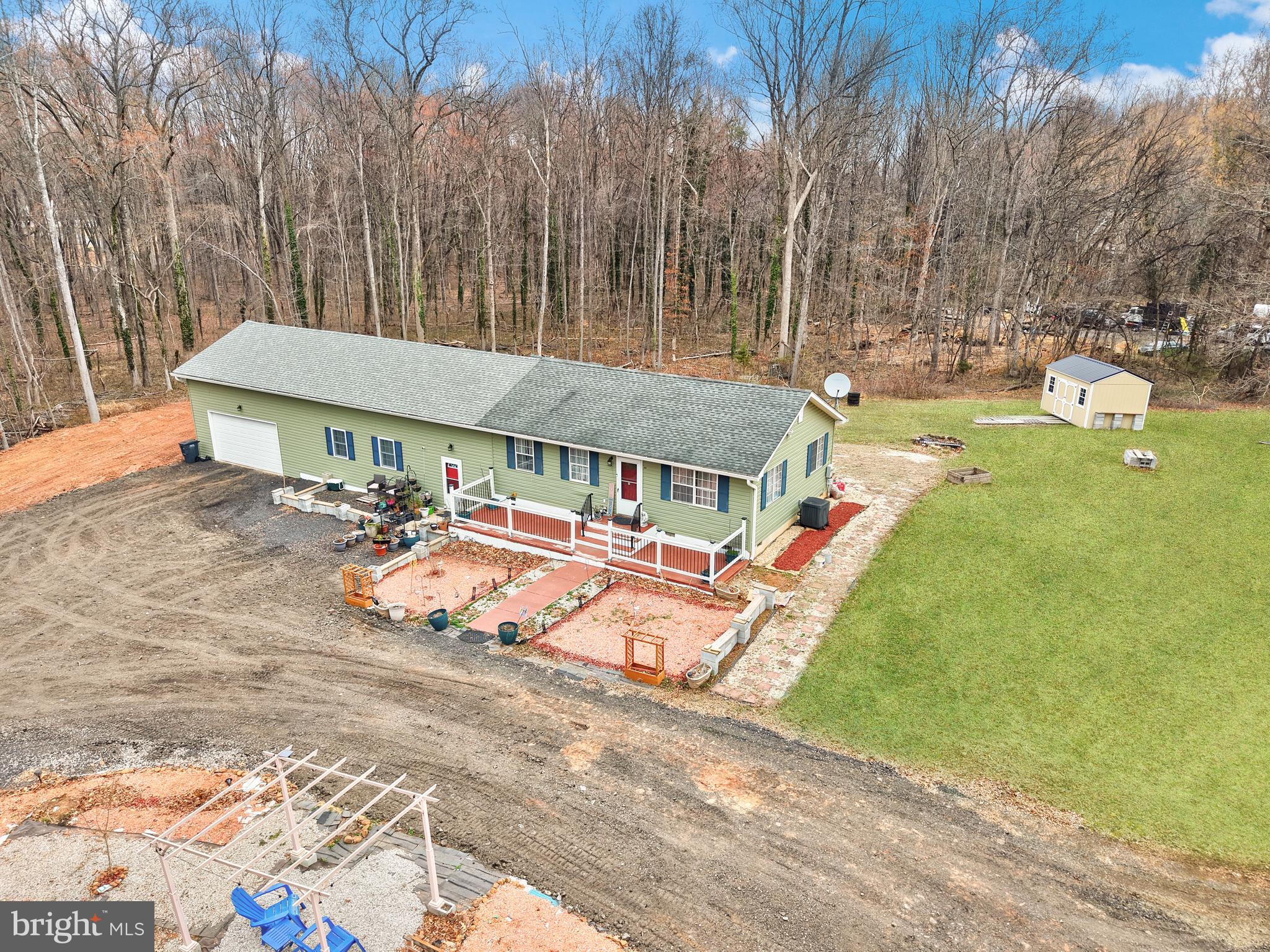 9463 Rogues Road Midland, VA 22728 - Photo 10 of 35 a view of a house with pool and sitting area