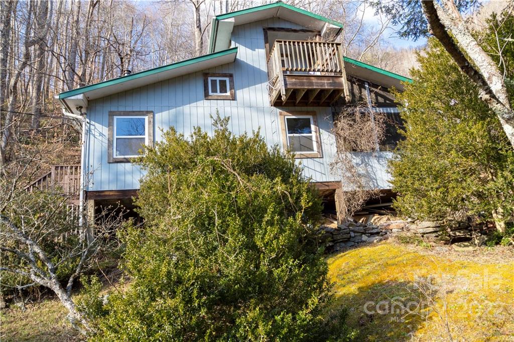 7442 Little Pine Road Marshall, NC 28753 - Photo 23 of 35 a view of a house with a yard and large tree