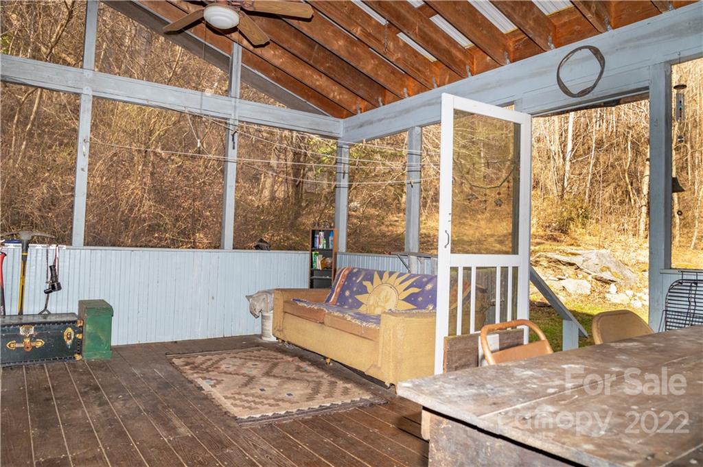 7442 Little Pine Road Marshall, NC 28753 - Photo 5 of 35 a living room with large windows