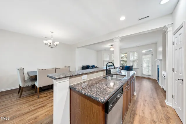 a kitchen with a table and chairs