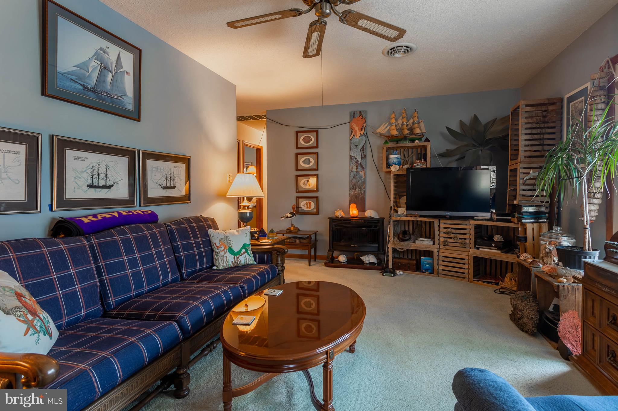 32396 Holly Ter Road Ocean View, DE 19970 - Photo 14 of 42 a living room with furniture and a flat screen tv