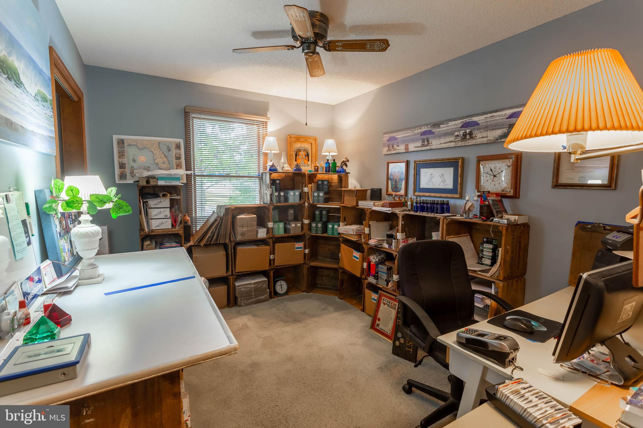 32396 Holly Ter Road Ocean View, DE 19970 - Photo 17 of 42 a view of a workspace with furniture and a window