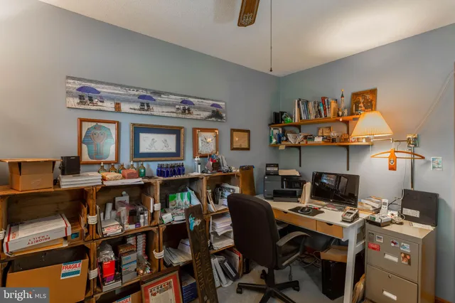 a view of a workspace with furniture