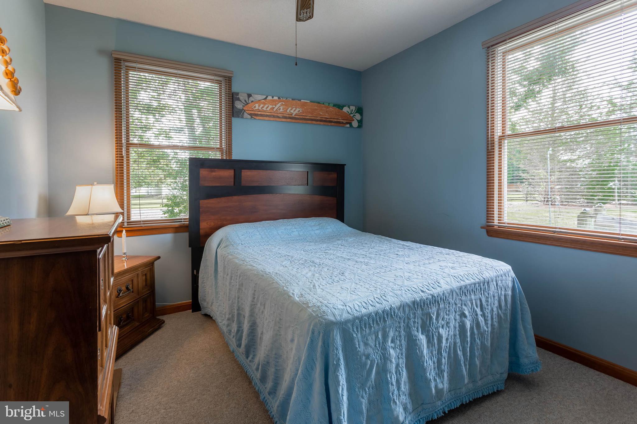 32396 Holly Ter Road Ocean View, DE 19970 - Photo 19 of 42 a bedroom with a bed and a window