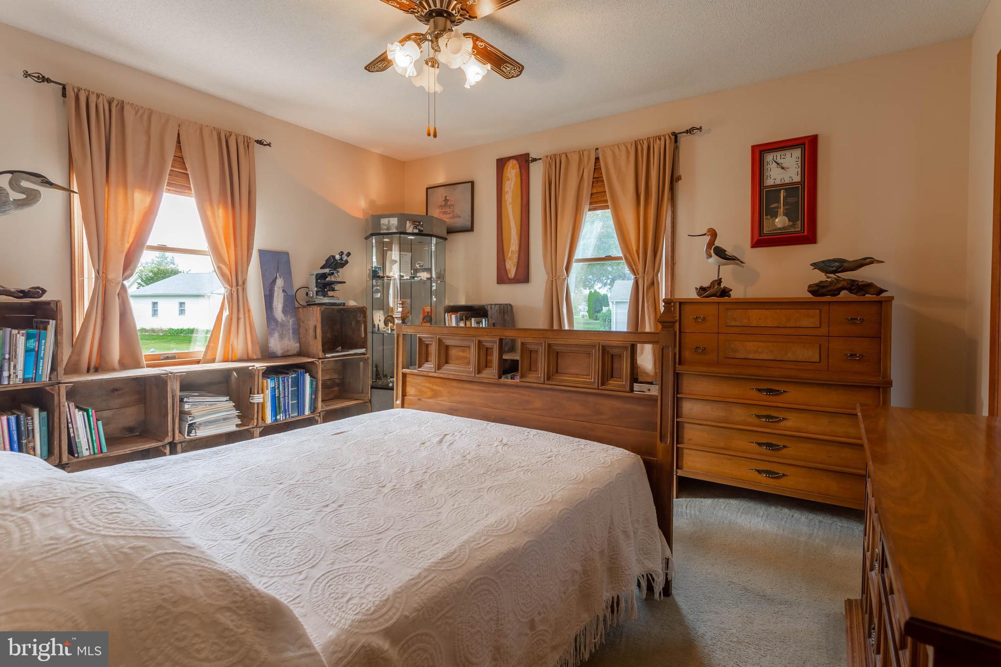 32396 Holly Ter Road Ocean View, DE 19970 - Photo 21 of 42 a bedroom with a bed and a large window