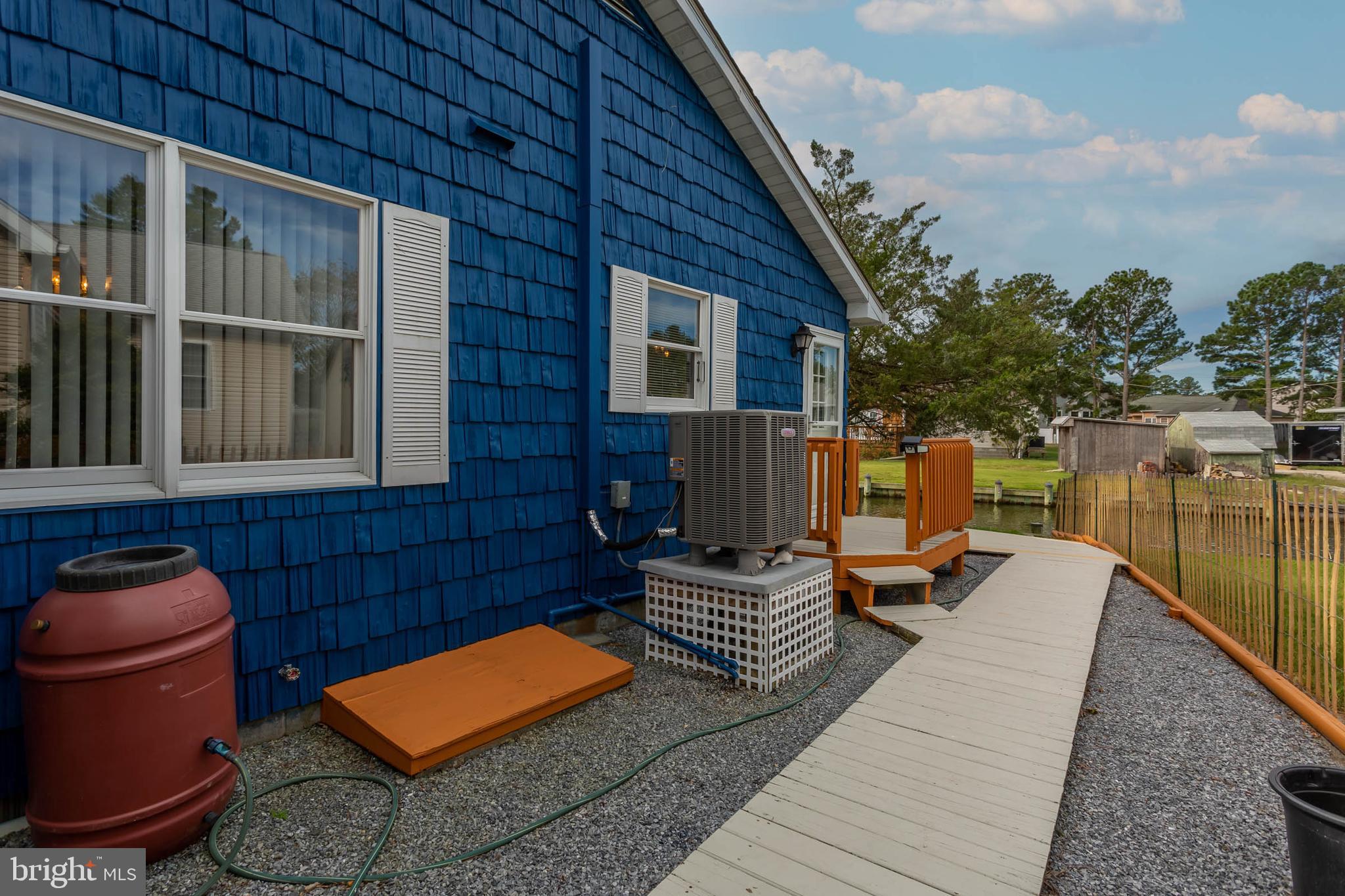 32396 Holly Ter Road Ocean View, DE 19970 - Photo 27 of 42 a backyard of a house with seating space