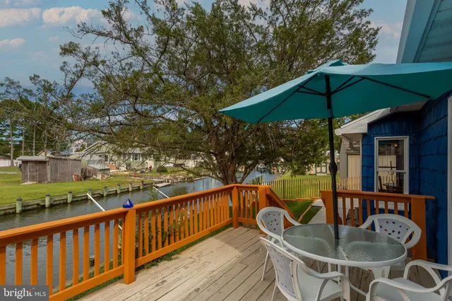 a balcony with table and chairs