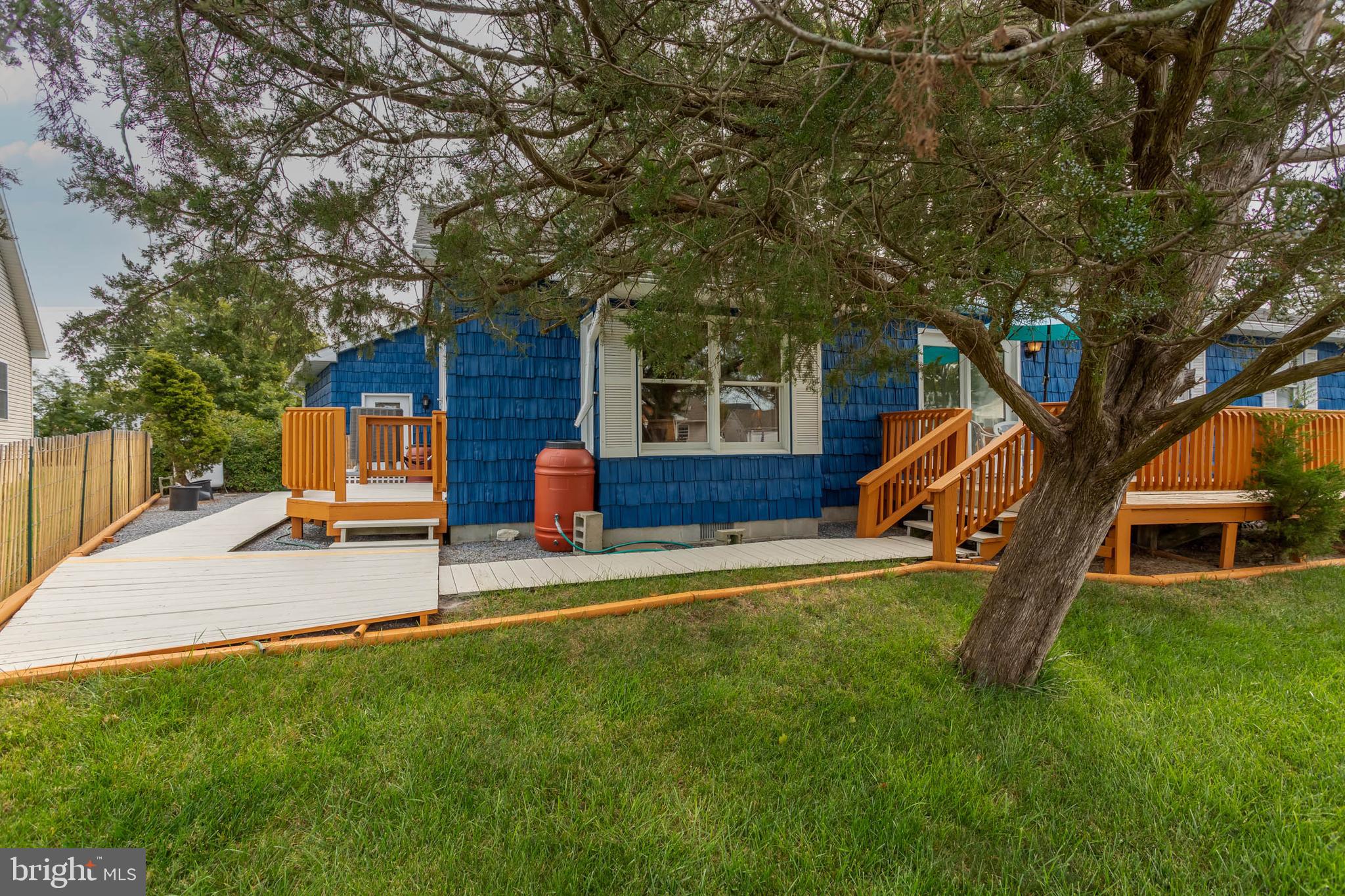32396 Holly Ter Road Ocean View, DE 19970 - Photo 30 of 42 a house view with a sitting space and garden