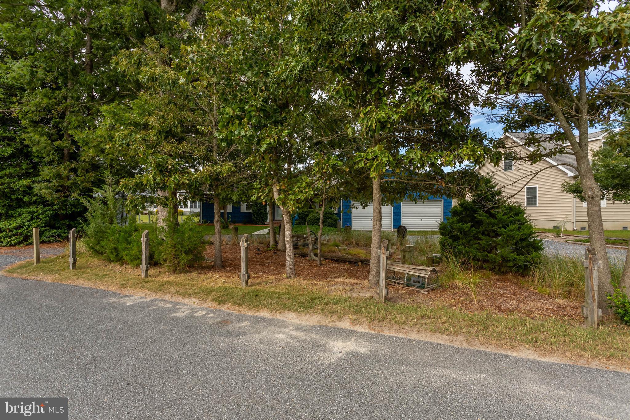 32396 Holly Ter Road Ocean View, DE 19970 - Photo 34 of 42 a backyard of a house with trampoline