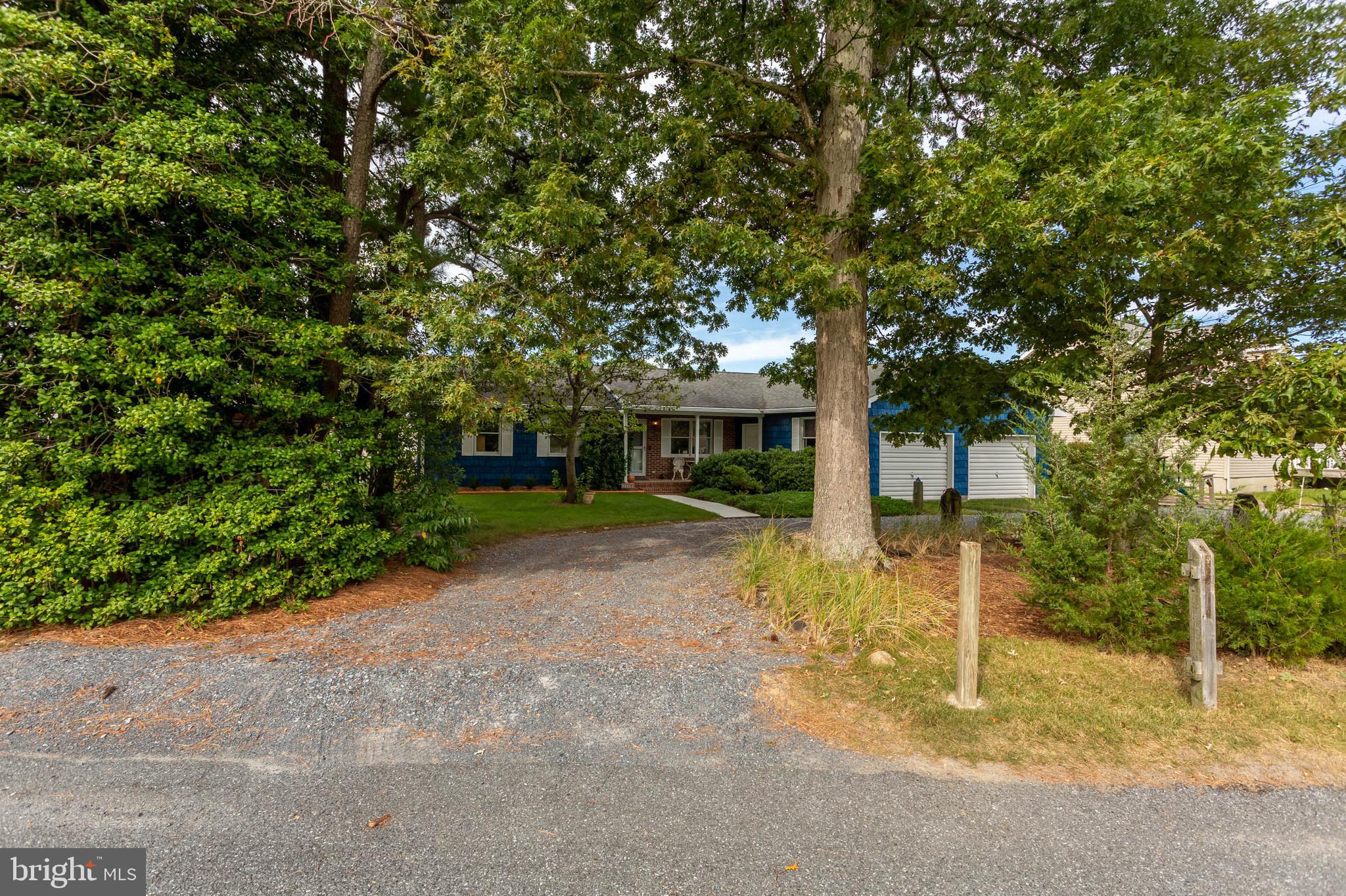 32396 Holly Ter Road Ocean View, DE 19970 - Photo 35 of 42 a view of a house with a backyard