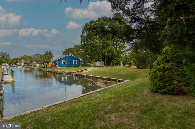 a view of a lake with houses in front of it