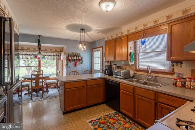 a kitchen with lots of counter top space and dining table