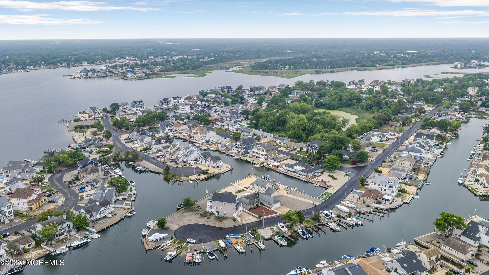 9 Cross Trees Road Brick, NJ 08723 - Photo 114 of 126 an aerial view of a city with lots of residential buildings ocean and mountain view in back