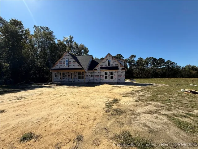 a house with swimming pool in front of it