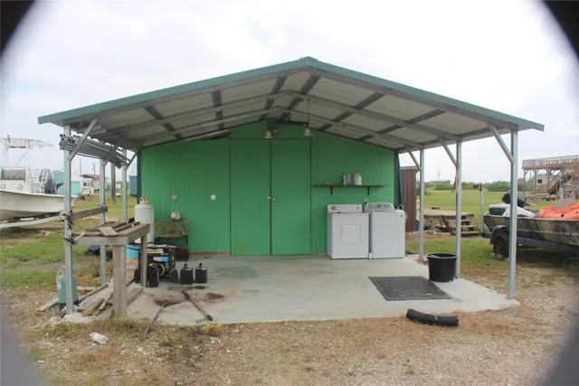 a view of a chairs and table in patio
