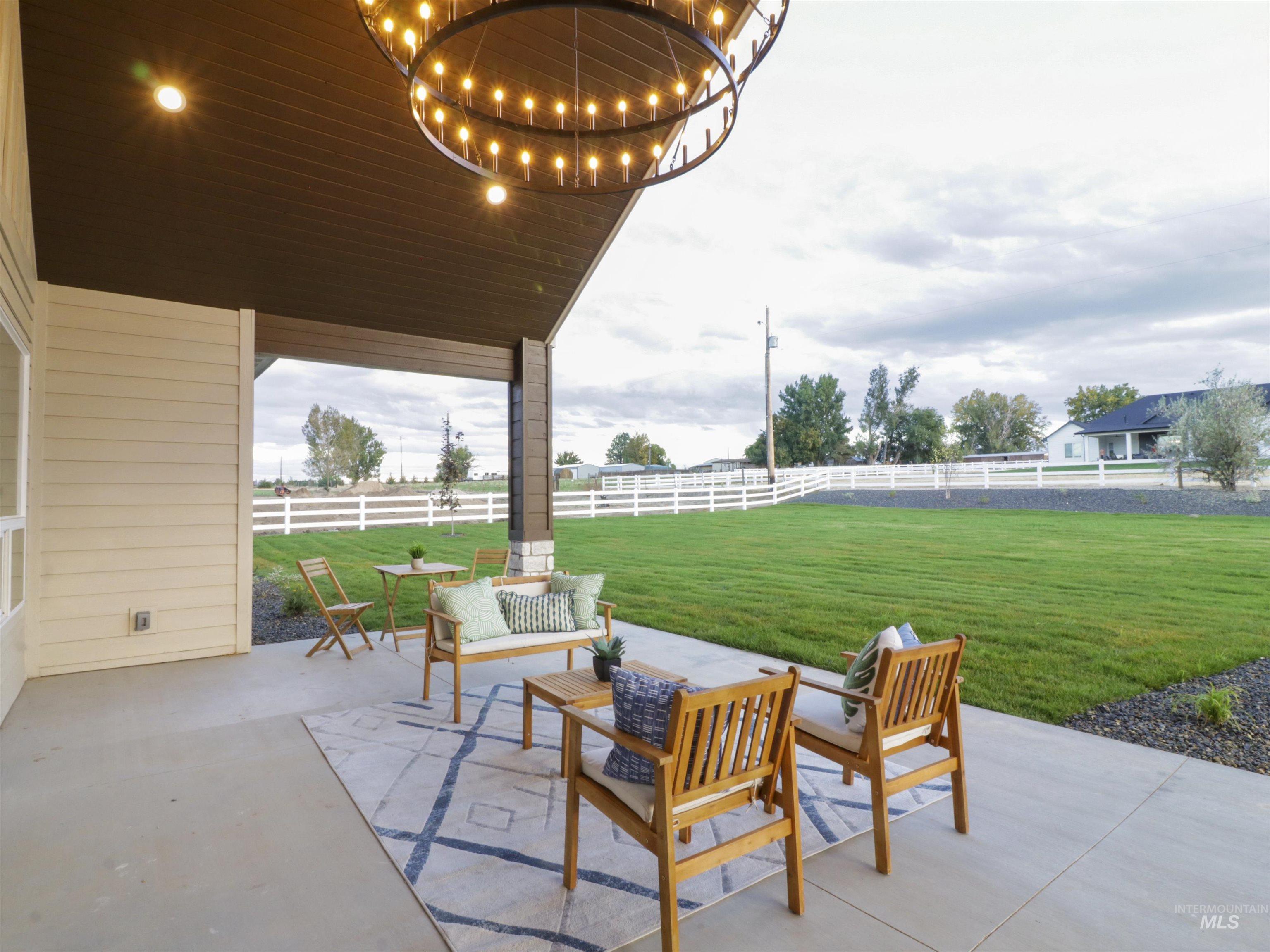 8991 Edna Lane Middleton, ID 83644 - Photo 39 of 50 Fenced backyard with a patio area and an outdoor hangout area