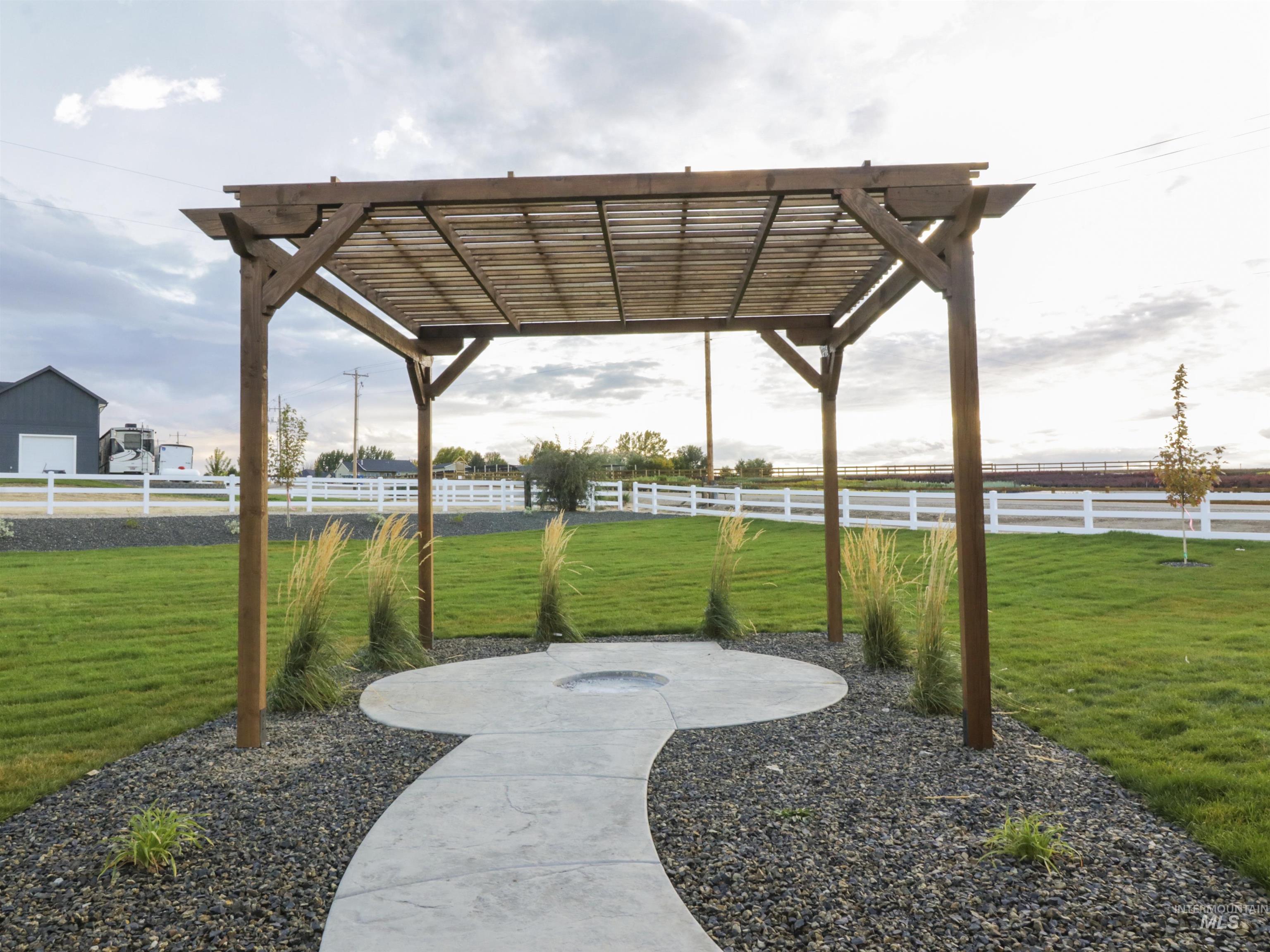 8991 Edna Lane Middleton, ID 83644 - Photo 41 of 50 View of property's community with a pergola, a fenced backyard, and a patio