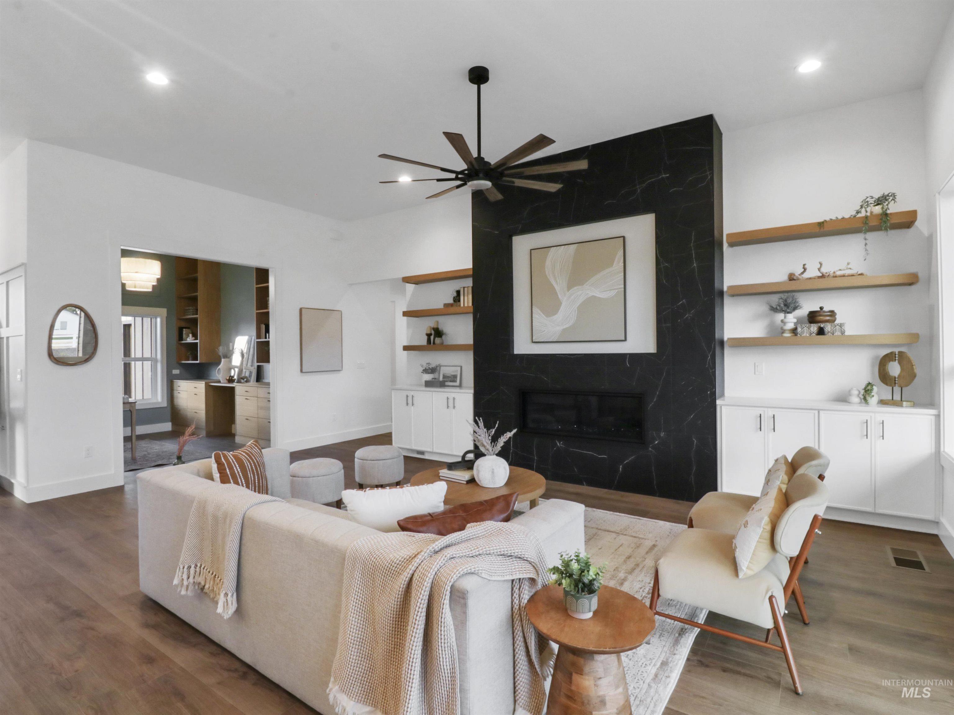 8991 Edna Lane Middleton, ID 83644 - Photo 6 of 50 Living area with wood finished floors, a high end fireplace, a ceiling fan, and recessed lighting
