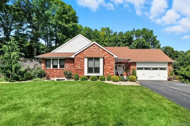 a front view of a house with a garden and porch