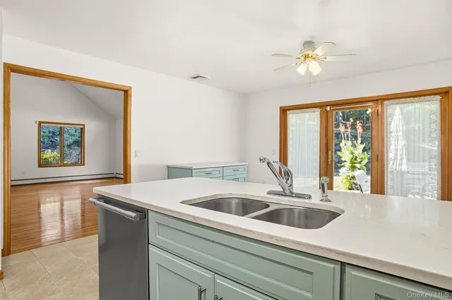 a kitchen with a sink and a window