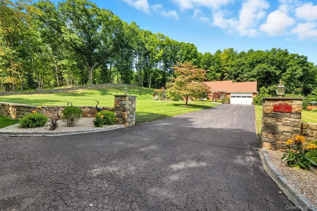 a bedroom with a large bed and a large window