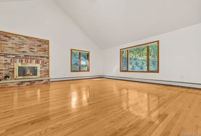 a view of an ocean & mountain view from a big room