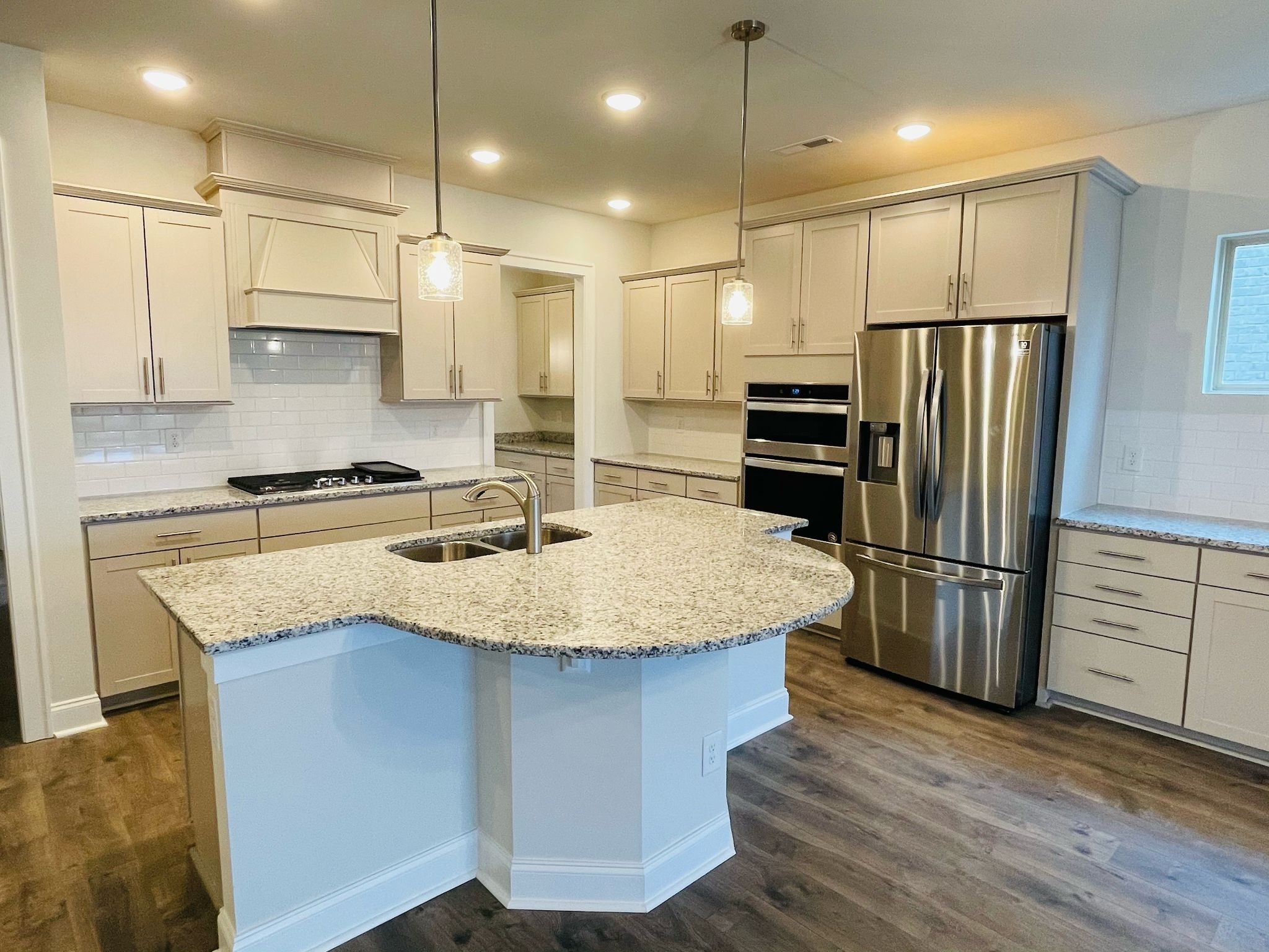 1108 Carlisle Place Mount Juliet, TN 37122 - Photo 4 of 20 a kitchen with kitchen island a counter top space stainless steel appliances and cabinets