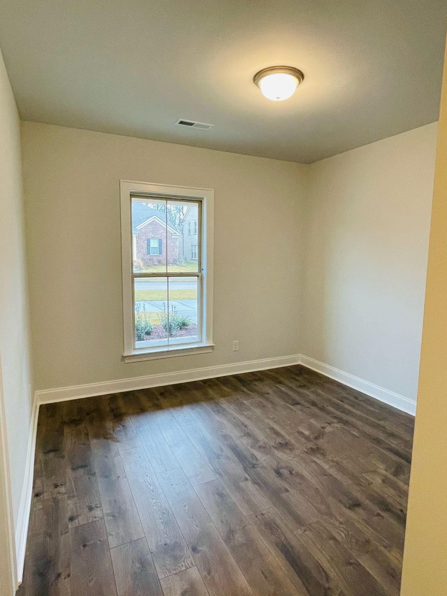 1108 Carlisle Place Mount Juliet, TN 37122 - Photo 6 of 20 an empty room with wooden floor and windows