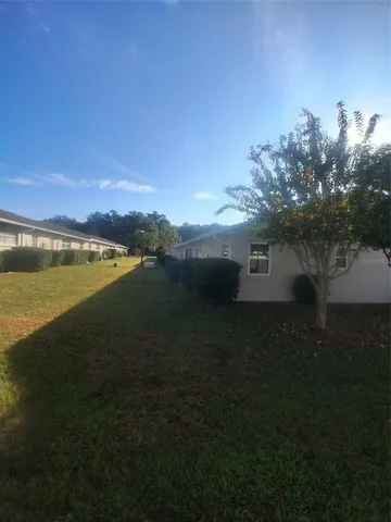 a view of a lake with a big yard