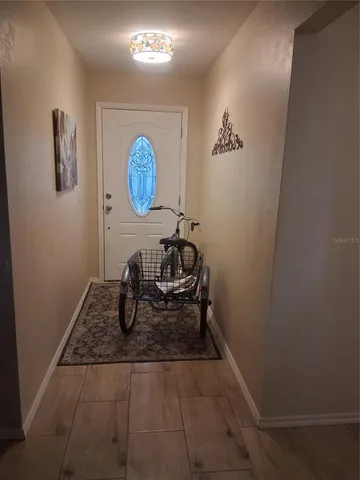 a view of a hallway with paintings on the wall