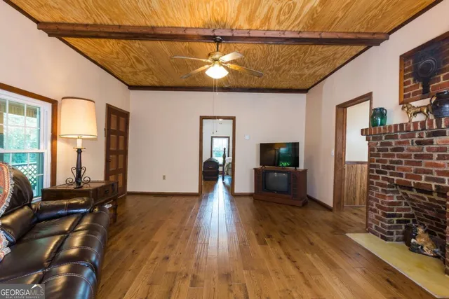 a view of a livingroom with furniture and a flat screen tv