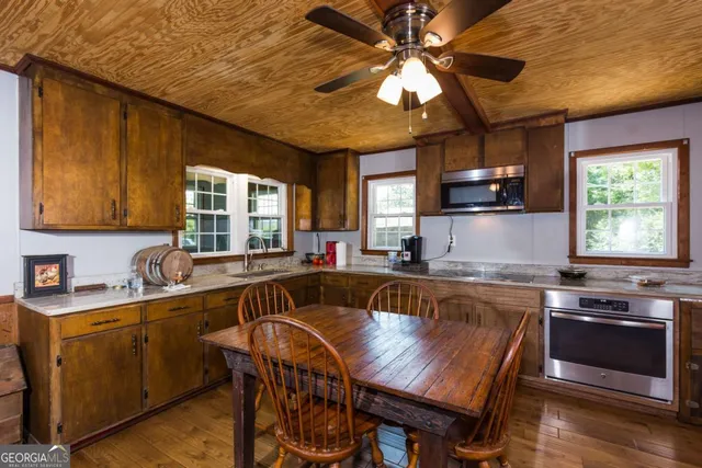 a view of a dining room with furniture and window