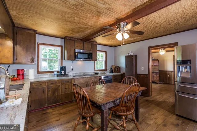 a kitchen with a sink stove and microwave