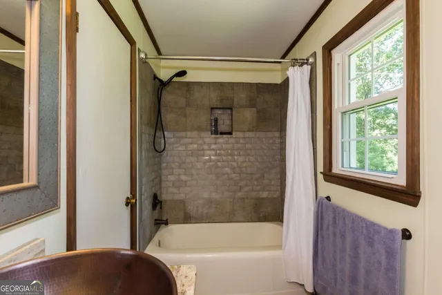 a work room with furniture and a window