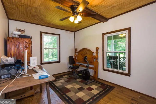 a bedroom with furniture and a window