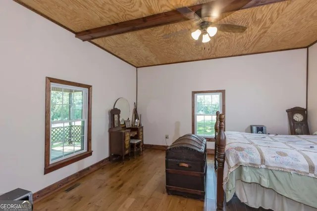 a bed room with a bed and a television