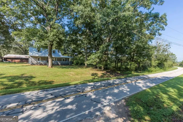 a view of a field with of trees