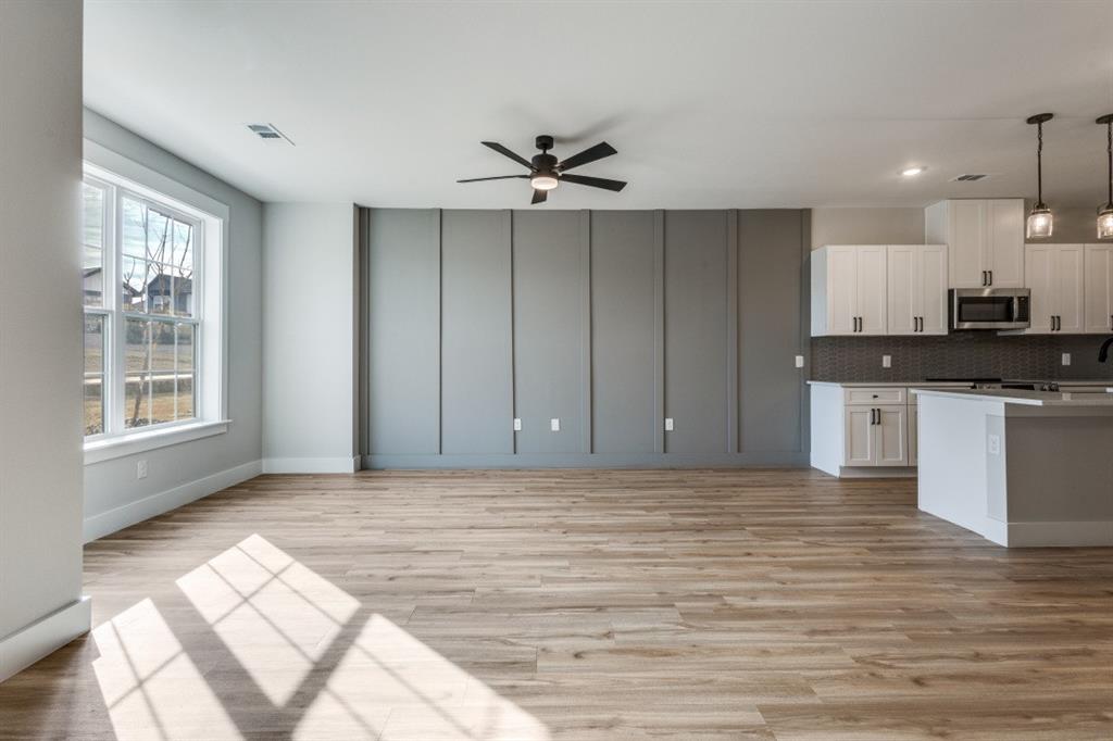 1610 Palladio Loop Princeton, TX 75407 - Photo 3 of 20 a view of kitchen with granite countertop cabinets and window