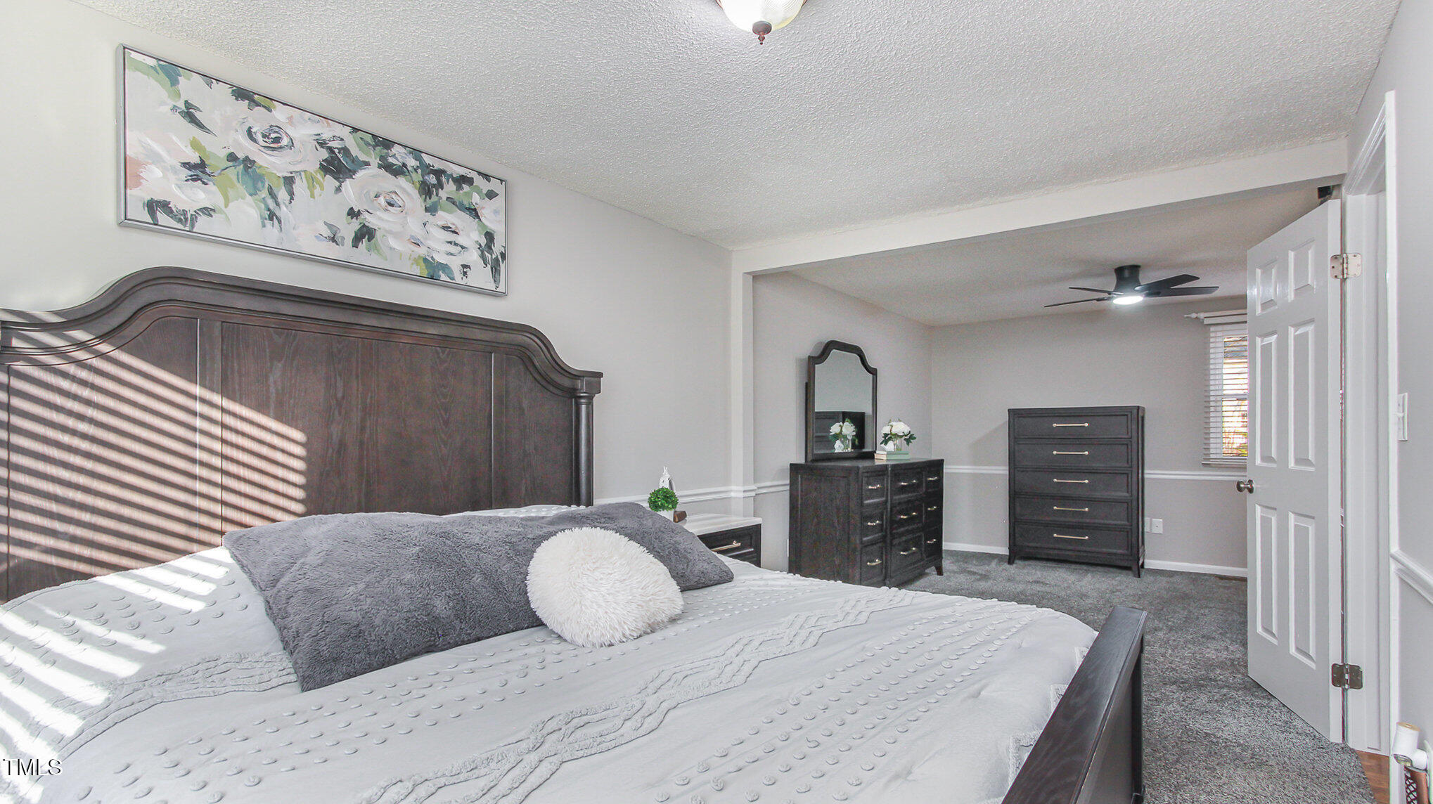 918 Templeridge Road Wake Forest, NC 27587 - Photo 6 of 12 a bedroom with a bed and dresser with mirror