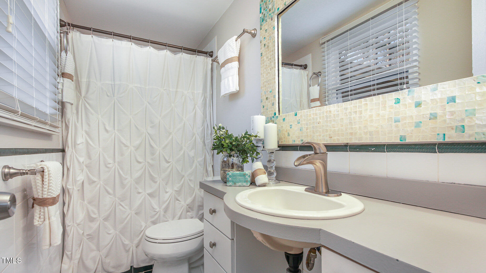 918 Templeridge Road Wake Forest, NC 27587 - Photo 7 of 12 a bathroom with a sink toilet and a mirror