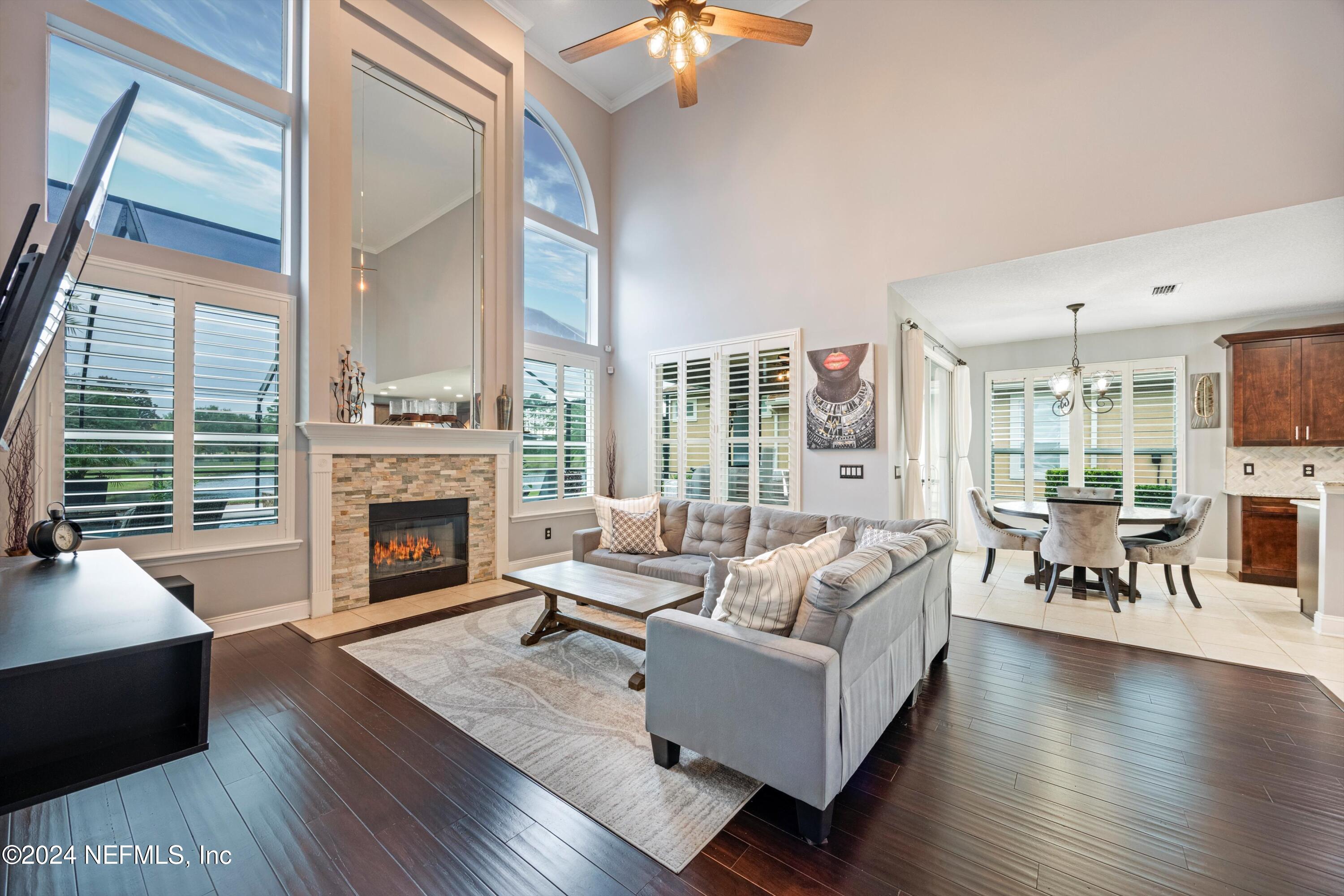 1843 South Landguard Road St. Augustine, FL 32092 - Photo 13 of 67 a living room with furniture fireplace and a large window